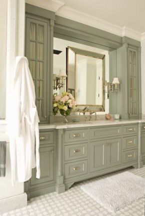 The absolute perfect shade of nuanced greyed green in this lovely master bathroom vanity by Lucas Studio Inc. Love the