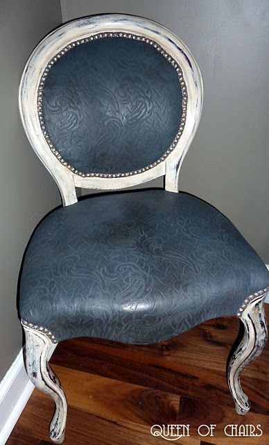 The fabric was painted with chalk paint and then rubbed with wax to look like embossed leather.
