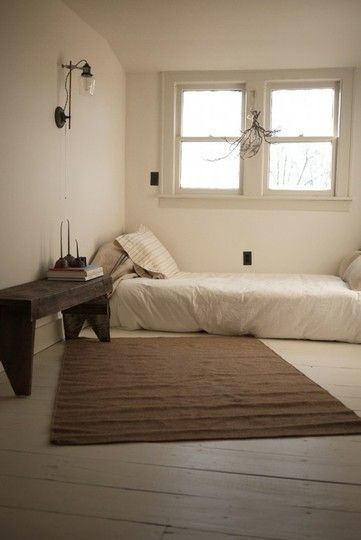 This is unrealistic due to the ridiculous amount of STUFF I have, but I really would love this minimalist bedroom.