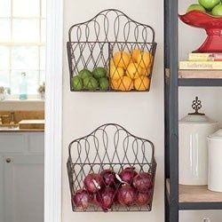 Using magazine racks to hold produce in kitchen.
