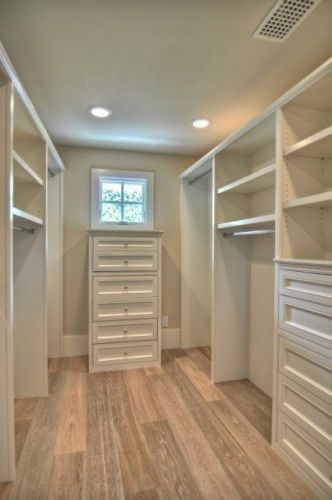 Walk-in closet with a window love the natural light. Love the extra storage drawers too.