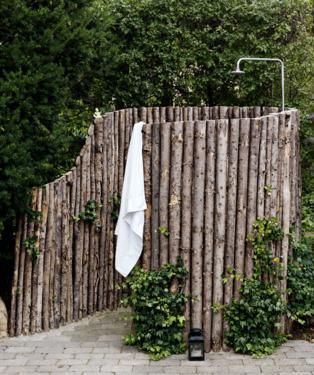 A basic outdoor shower that takes care of business and gives a nice rustic look.