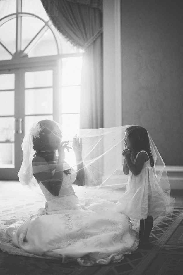 An adorable shot of the bride with the flower girl. | 42 Impossibly Fun Wedding Photo Ideas Youll Want To Steal