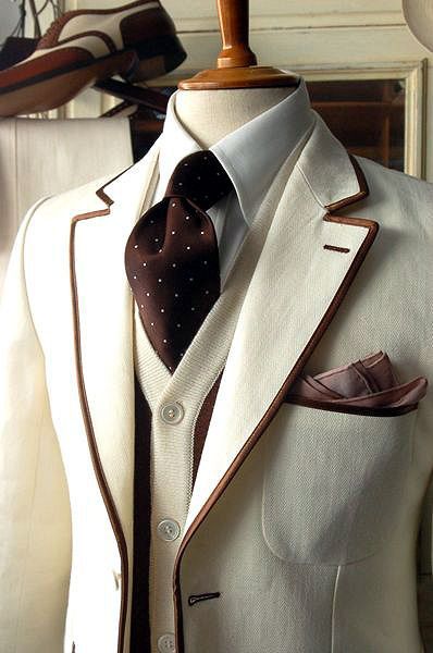 Awesome Mens ivory blazer piped in brown, contrasting knit vest, ivory shirt & brown tie w/ ivory polka dots.