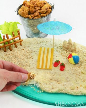 Beach pretzel dip – make a splash at your next party with this easy and delicious pretzel dip. Accessorized to look like a sandy