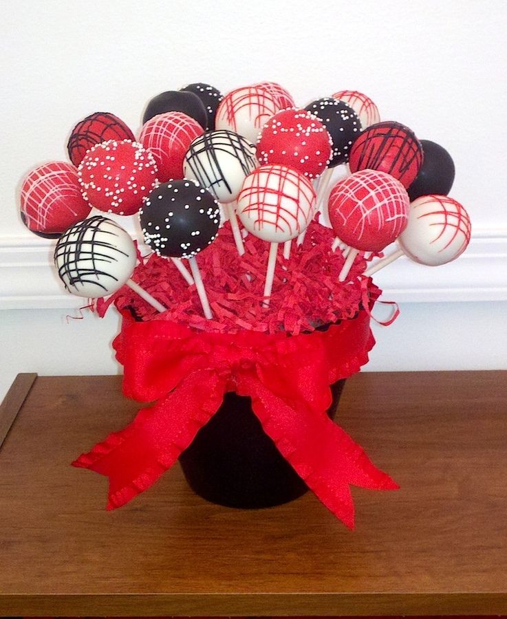 Cake pops colored and decorated in red, black, and white for a sweet 16s