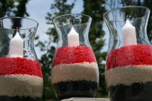 Centerpieces using dyed red and blue rice and then pour and layer thered, white and blue.  Accent with a candle for a festive