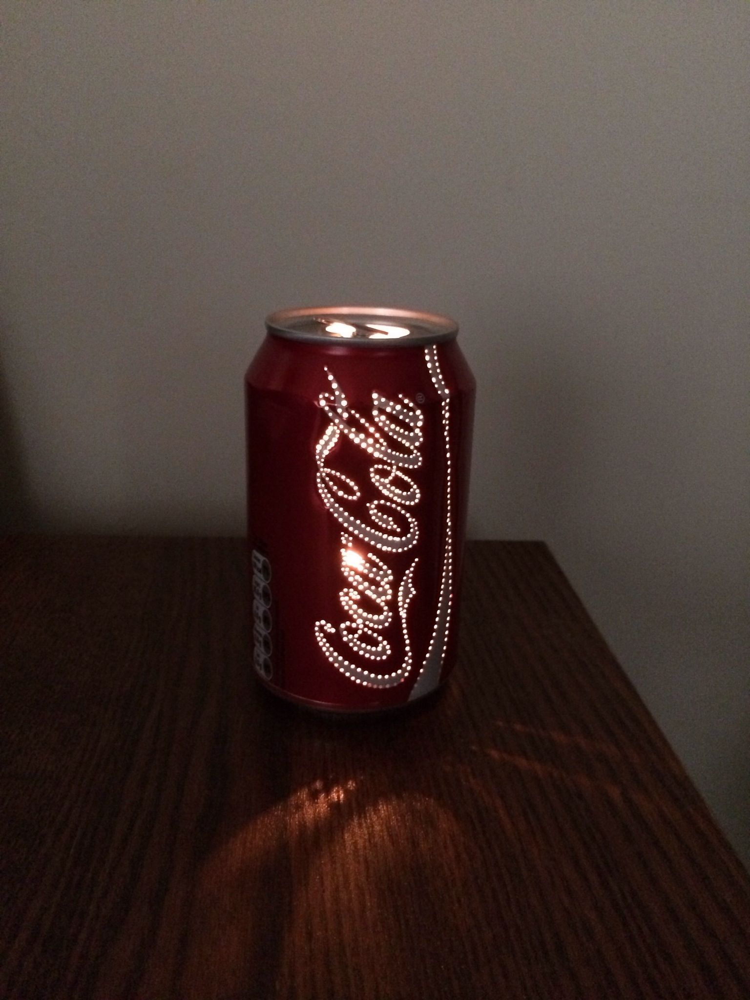 Cool! Poke holes in a empty soda can and put a light inside! Only HOW would you get the light in…