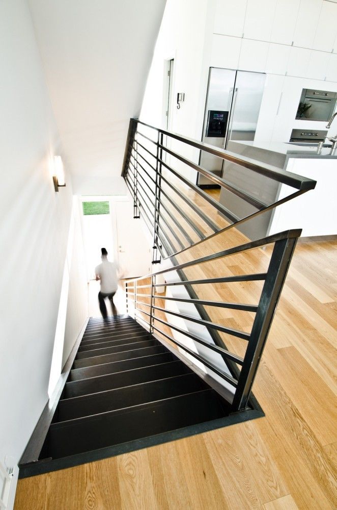 Creative solution for a stair rail in the same plane.  Pb Elemental Architecture