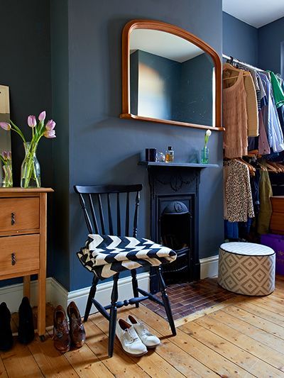 Credit: Ingrid Rasmussen The dressing room – formerly a second bedroom – is painted an inky black (Railings by Farrow & Ball