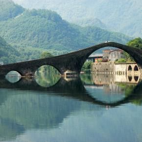 Devils Bridge, Lucca, Italy.  Ponte della Maddalena (Italian: “Bridge of Mary Magdalene”) is a bridge crossing the Serchio river