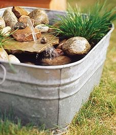 DIY::Easy mini water feature in an old bathtub. LOVE this!…