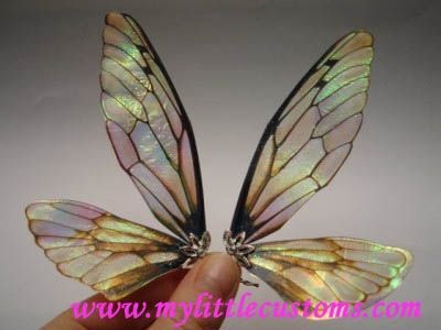 Fairy Wing Tutorials wings made out of something called Angelina Film that you can get at a hobby store. Beautiful!