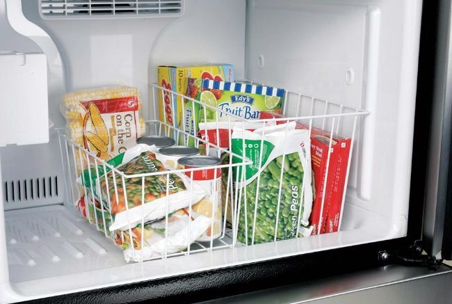 I like this idea for our travel trailer fridge.  I think keeping vegetables in one basket and meats in the other should help keep