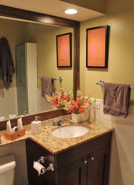 I love this little bathroom.  Especially the color of the walls and the oversized mirror that extends above the toilet.