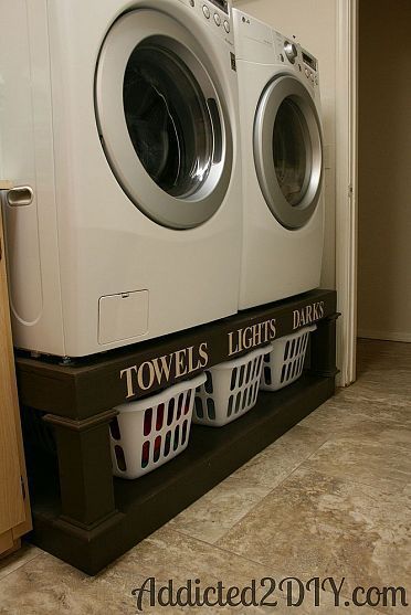 Laundry room organization! Place raised side-load washer and dryer makes it a little easier on doing laundry.