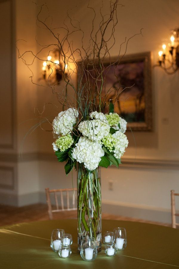 Love hydrangeas, love the height. Just needs more color and less sticks going all the way down the vase