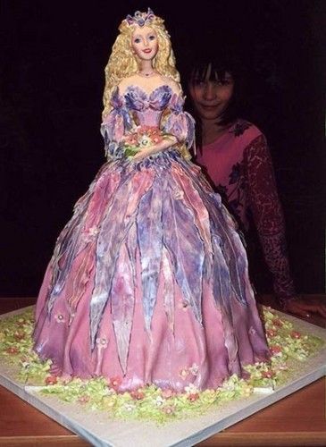 My youngest daughter would totally flip out over this cake.  She watches “Princess Cake Boss” cake tutorials on youtube and