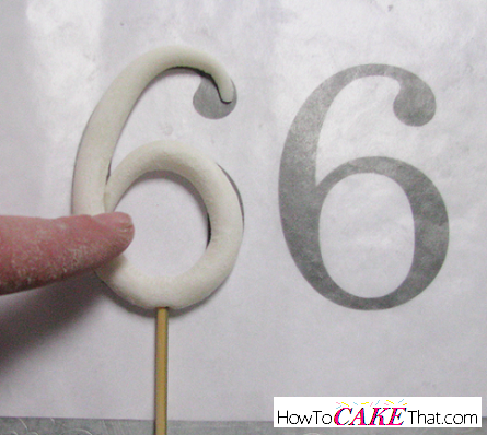 One edible decoration every cake decorator needs to know how to make is a gum paste or fondant stand up number topper! Number