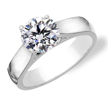 Round cut diamond solitaire engagement ring with cathedral shank. – Love the setting/style!!!