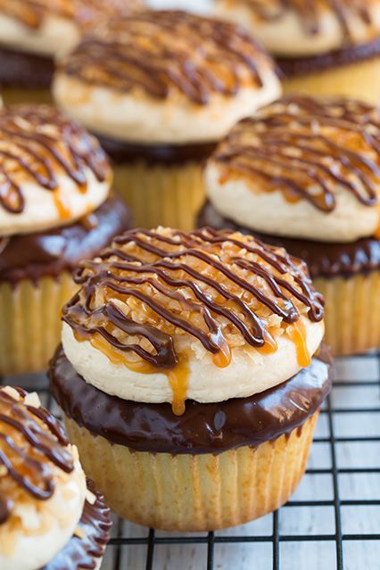 Samoa Cupcakes  – moist vanilla cupcake, thick chocolate ganache, caramel buttercream frosting, toasted coconut and