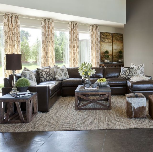 Sectional in center instead of against the walls. Dark couch and neutral curtains