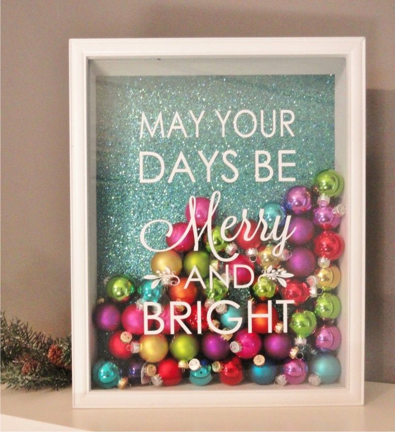 Shadow Box Fame. With scrapbook paper, small colored ornaments & vinyl saying: “MAY YOUR DAYS BE MERRY AND BRIGHT.” :)
