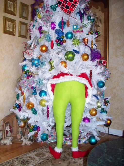 Stuff green tights full of pillow stuffing and shove him in your tree .. I LOVE this! Too funny!