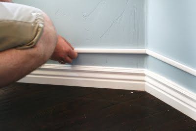 TA-DA!!!!!! Chunkier baseboards!!!!!!  With about $6 worth of tiny trim above the small existing baseboard, then painted to all