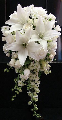 White Lily and Rose Wedding Bouquet I said I didnt like white flowers with a white dress, but this has caught my eye!