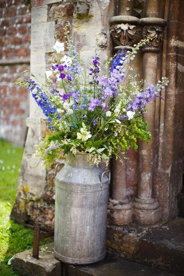Wild country blooms including delphiniums, peonies, campanula, ammi, cornflowers, larkspur, honesty, stephanandra and seedheads.