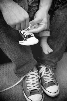 all I can think of is oh my gosh too cute ! father and son pic or a family pic in chucks ! lol