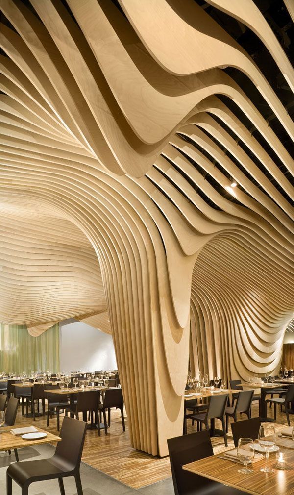 Banq Restaurant designed by Office dA. The ceiling and columns take the form of a 3-dimensional topographic map.