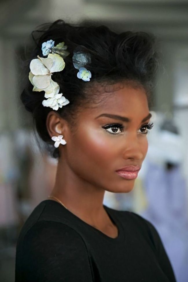 Beautiful African American black woman with flowers in hair