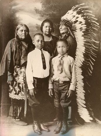Comanche family, early 1900s~Within the fabric of American identity is woven a story that has long been invisible—the lives and