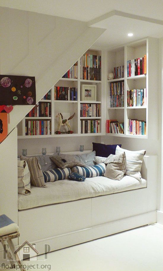 Cozy nook under the stairs – love this! Or maybe create something similar in the family room?