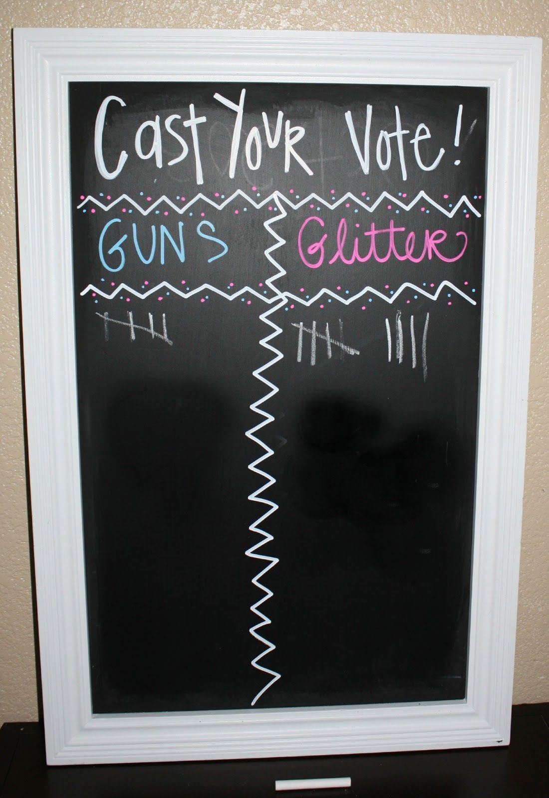 dont know if i would use “guns” or “glitter” but yet another great use out of a chalkboard! Gender Reveal Party