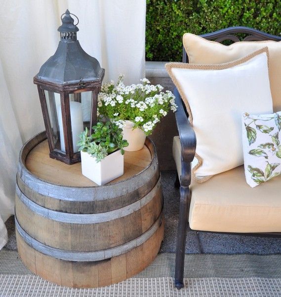 I want these half barrels for outdoor tables.  I adore this patio makeover and will adopt a few of its elements.
