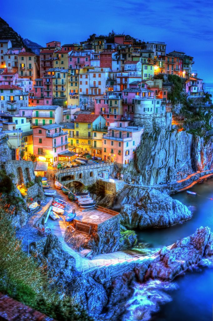 Manarola, Cinque Terre, Liguria, Italy ~ I love how the town is built into the landscape and how the landscape shapes the town