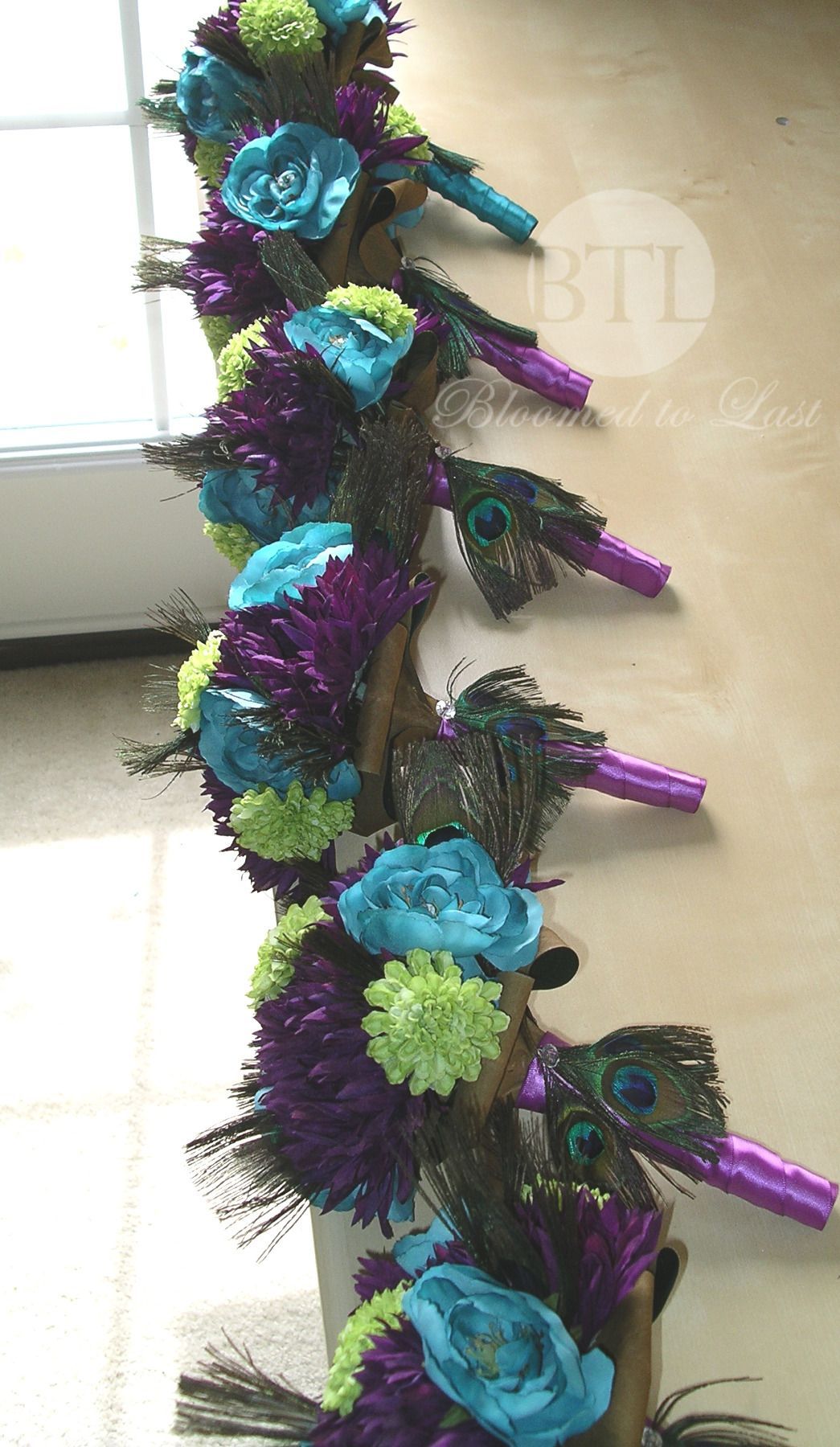 Peacock feather bouquets all lined up and ready to go. Stunning! WV, VA, MD, DC Wedding | Wedding Planning | Peacock Feather