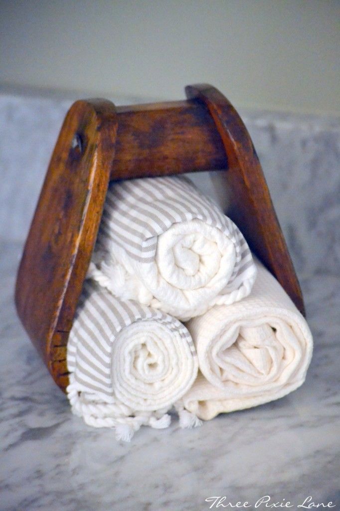 Repurpose your old stirrup as a towel holder in a guest bathroom or powder room like this one!