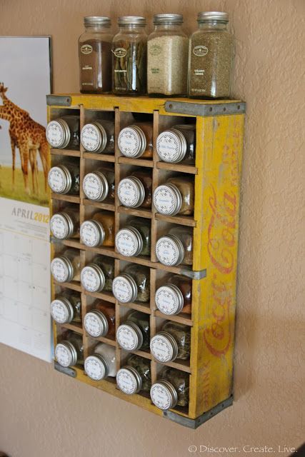 take a Vintage Coca-Cola Crate, hang on the wall, add glass jars filled with spices! cute!