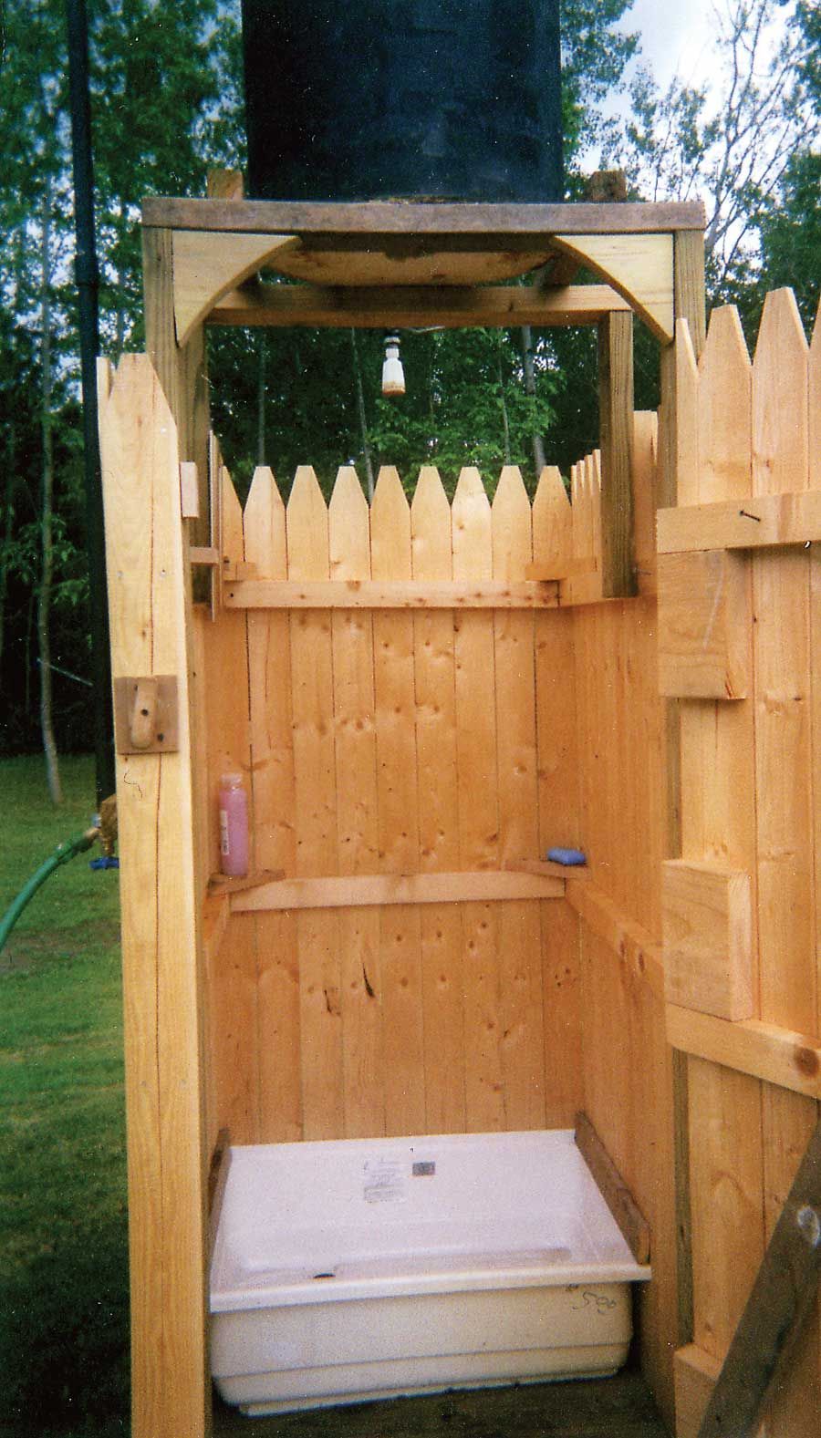 The water for this homemade outdoor shower is heated by the sun, saving you money and energy. You can build it with a bit of