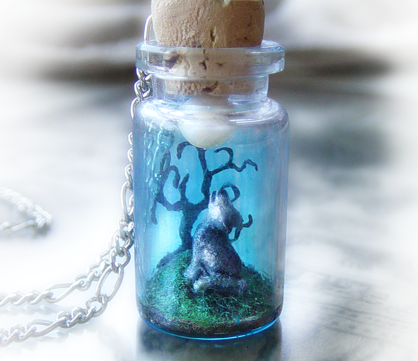 Wolf howling into the moon, clay scene bottle necklace. 34.00, via Etsy.