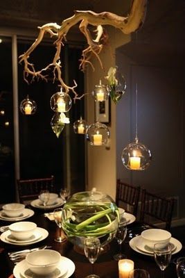Ahh!! Awesome alternative to chandelier, and electric lights can hang down to allow for less candle use
