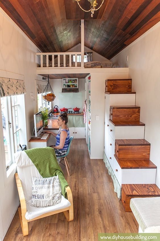 beautiful wood used and love the stair storage!! diy-house-building-young-family-tiny-house-and-plans-03