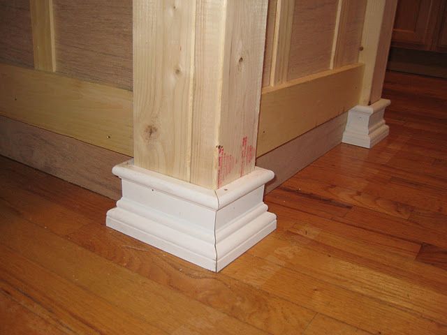 Beef up a kitchen island with board/batten, 2×4 corners, and molding “feet”