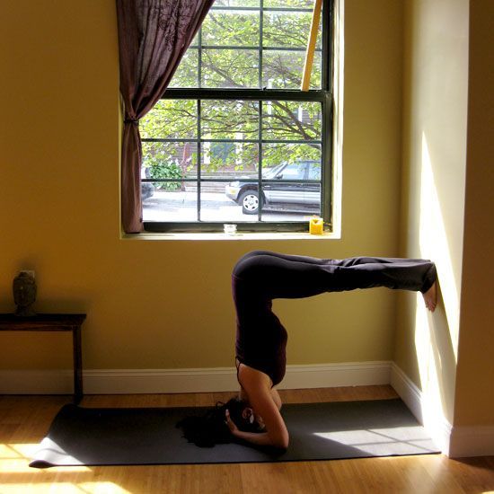 Bound Headstand Against a Wall: From Bound Headstand with Straight Legs, step both feet onto the wall, walking them up so your