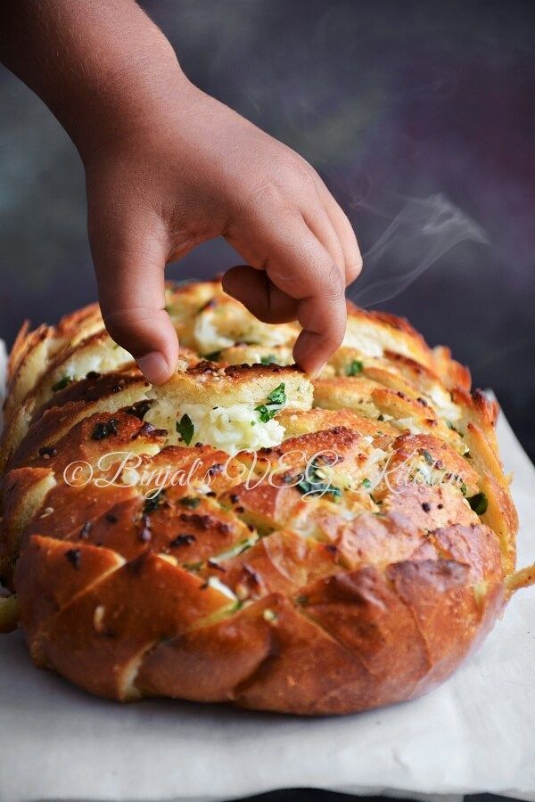 Cheesy Garlic Pull Apart Bread loaded with cheese, garlic, herb, butter. Quick under 30 mins. Good for a dinner party as an