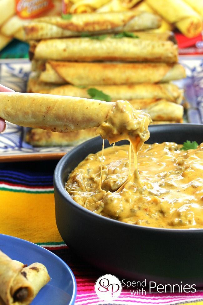 Cheesy Taquito Beef Queso Dip!  This perfect party dip is made with seasoned ground beef and tons of cheesy goodness!  Quick &